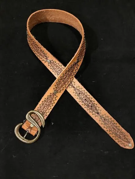 spirit tooled leather belt Tooled leather belt with an ornate buckle at Stefan Mann
